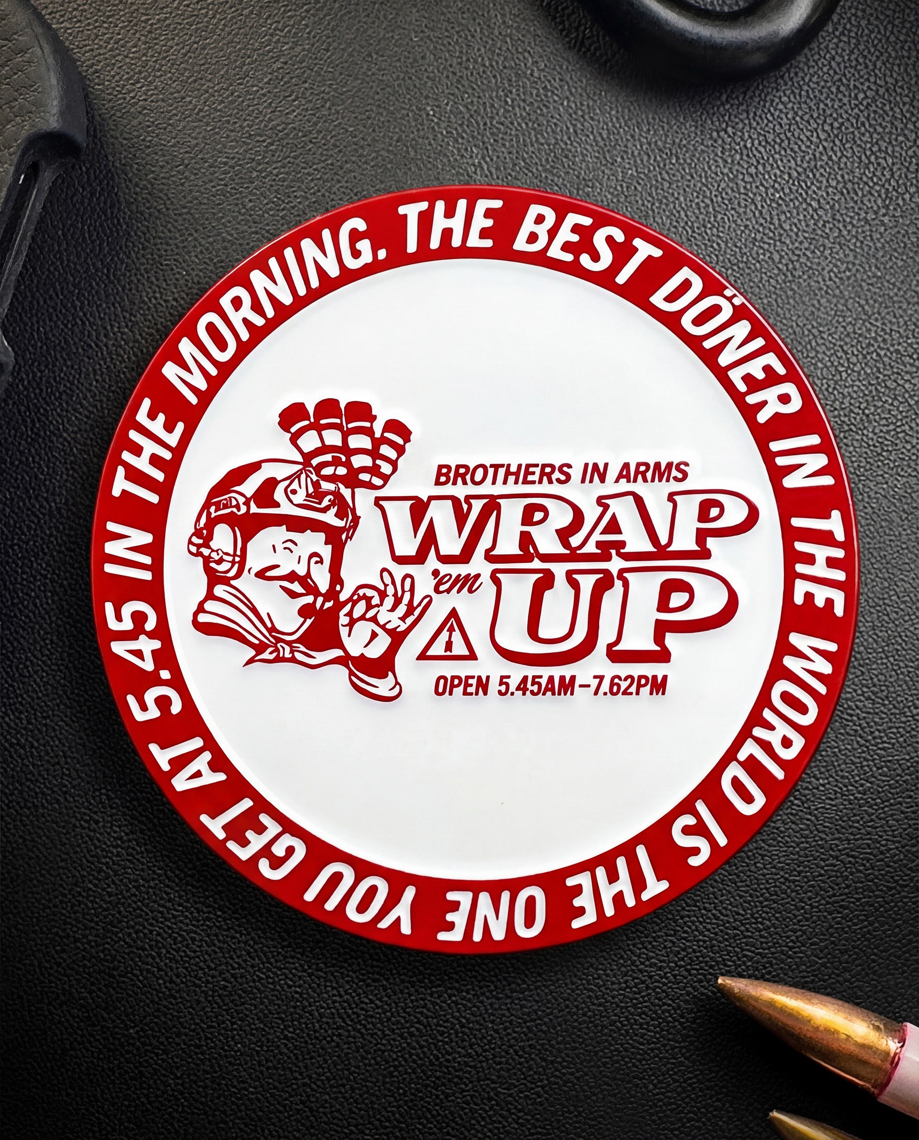 Circular Coin with text and graphics on a dark surface