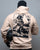 Person wearing a beige hoodie with a graphic design on the back against a gray background - Acta Non Verba Hoodie