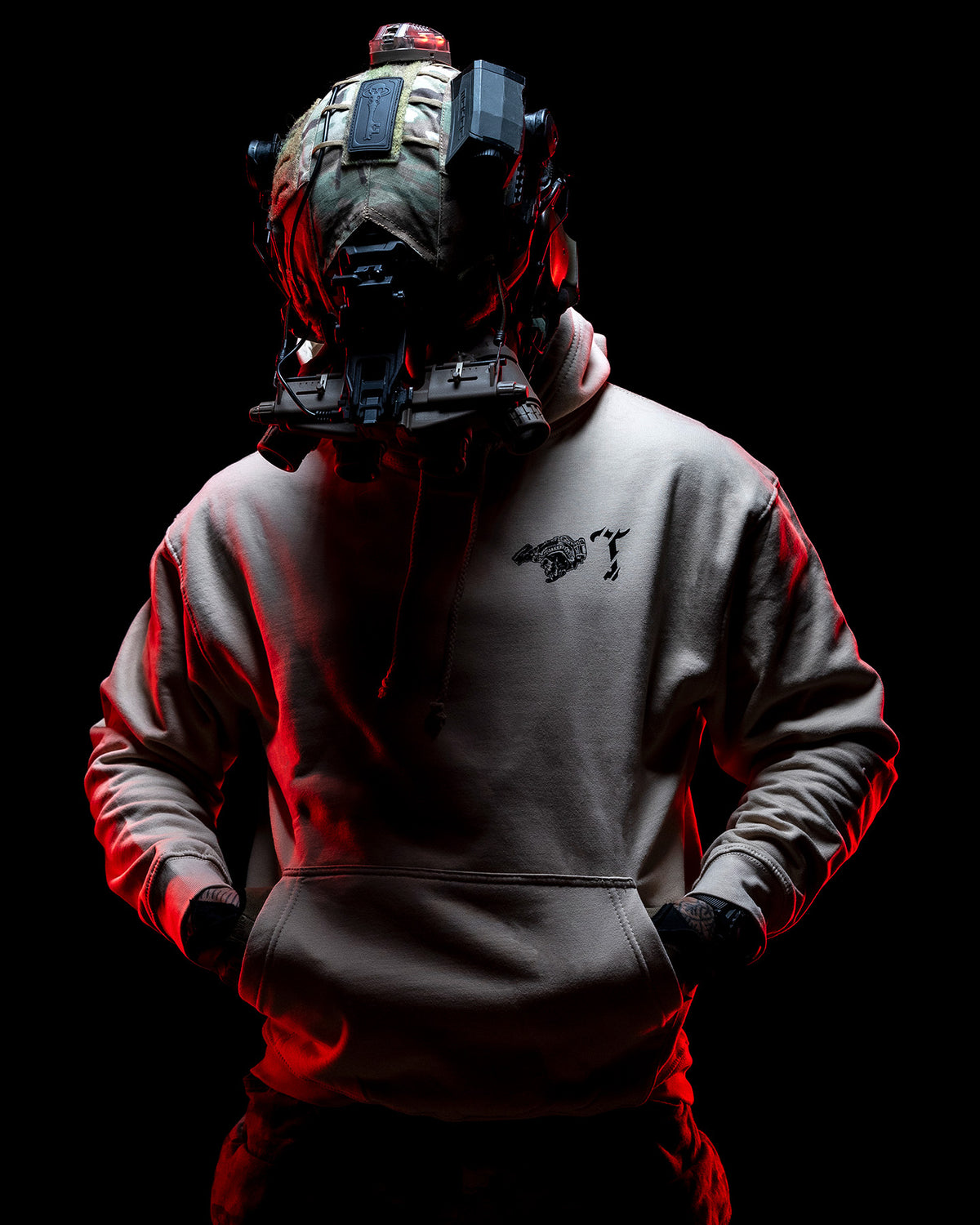 Man with helmet and night vision in the sand Air Assault Hoodie, lit red