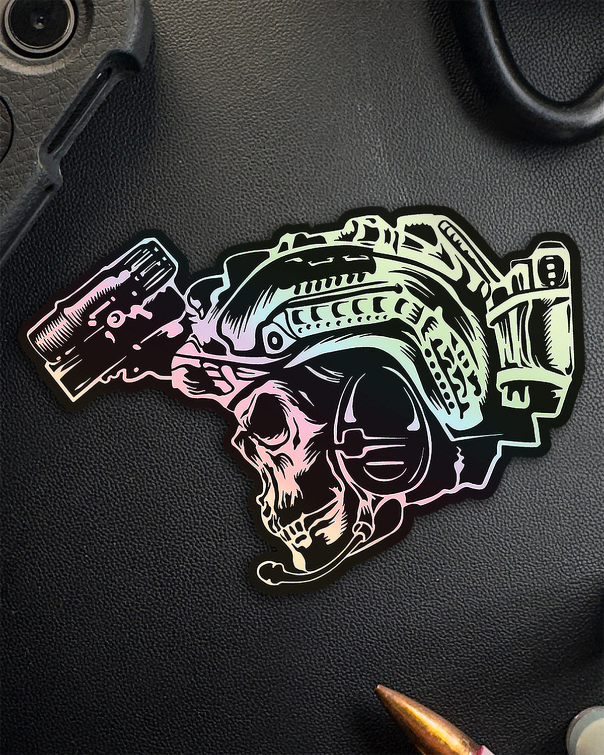 Single holographic BIA sticker with skull, helmet and night vision on a dark surface