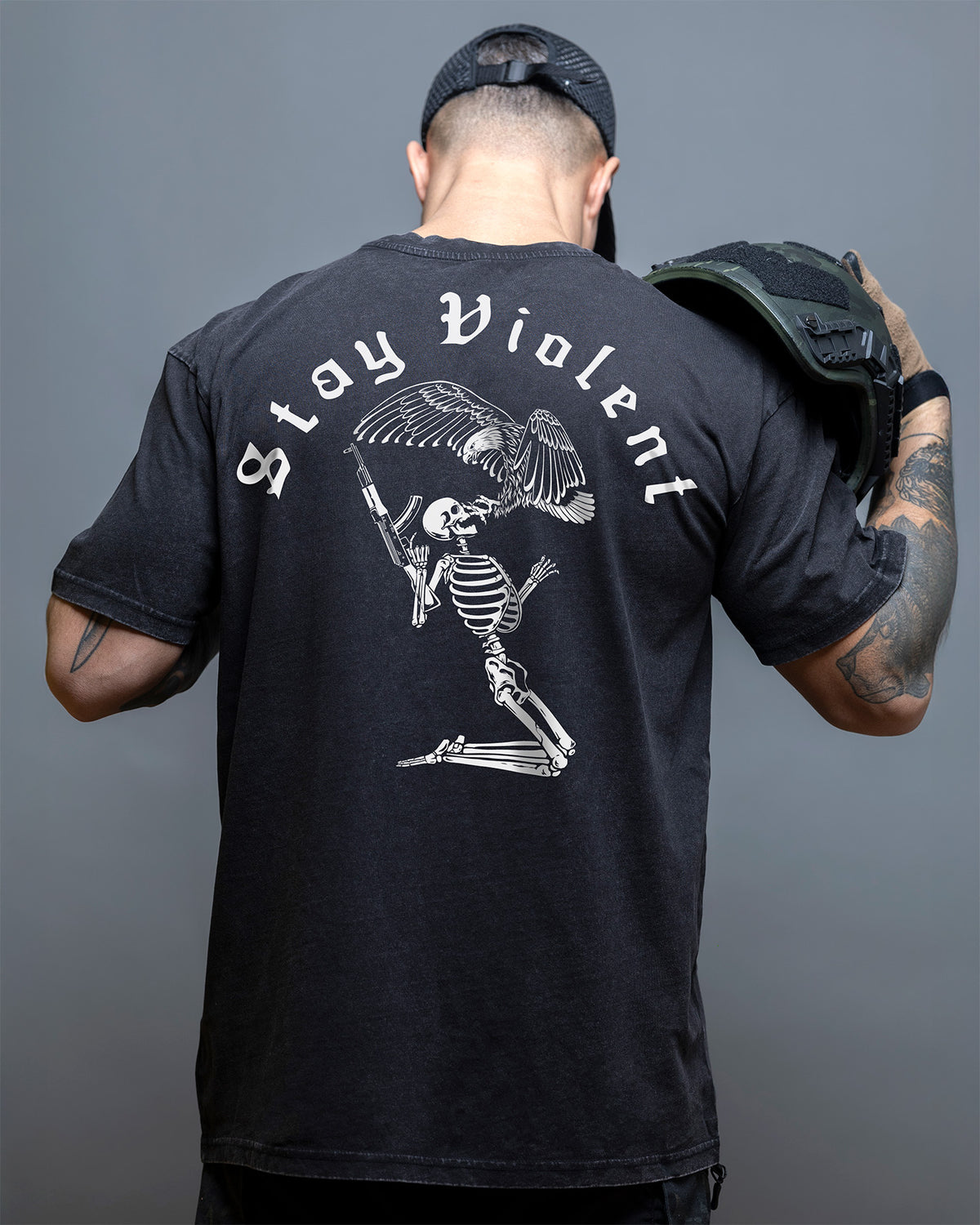 Rear view of the black Stay Violent Oversized Shirt with the skeleton back print