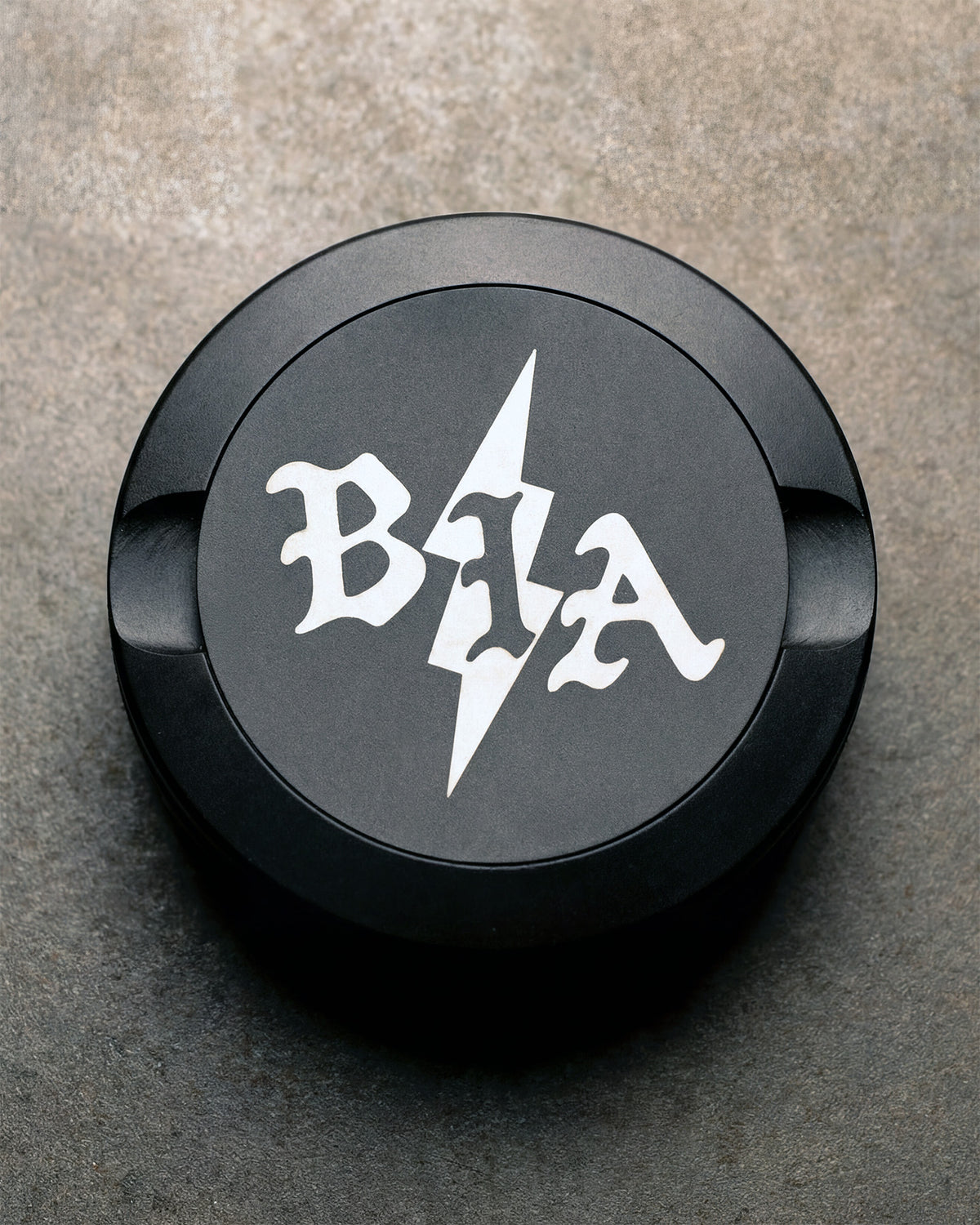 Black Bolt pouch can with the BIA lightning logo on the lid