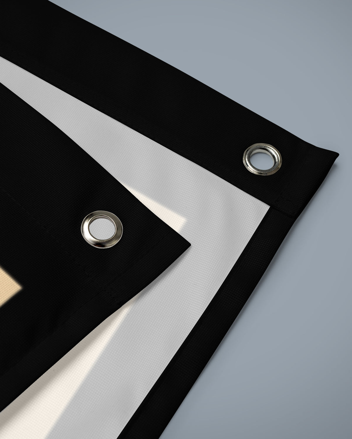 Close-up of the Acta Non Verba flag corner with reinforced edge and metal eyelets