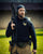 Man holding a rifle in an outdoor setting - Acta Non Verba Hoodie 