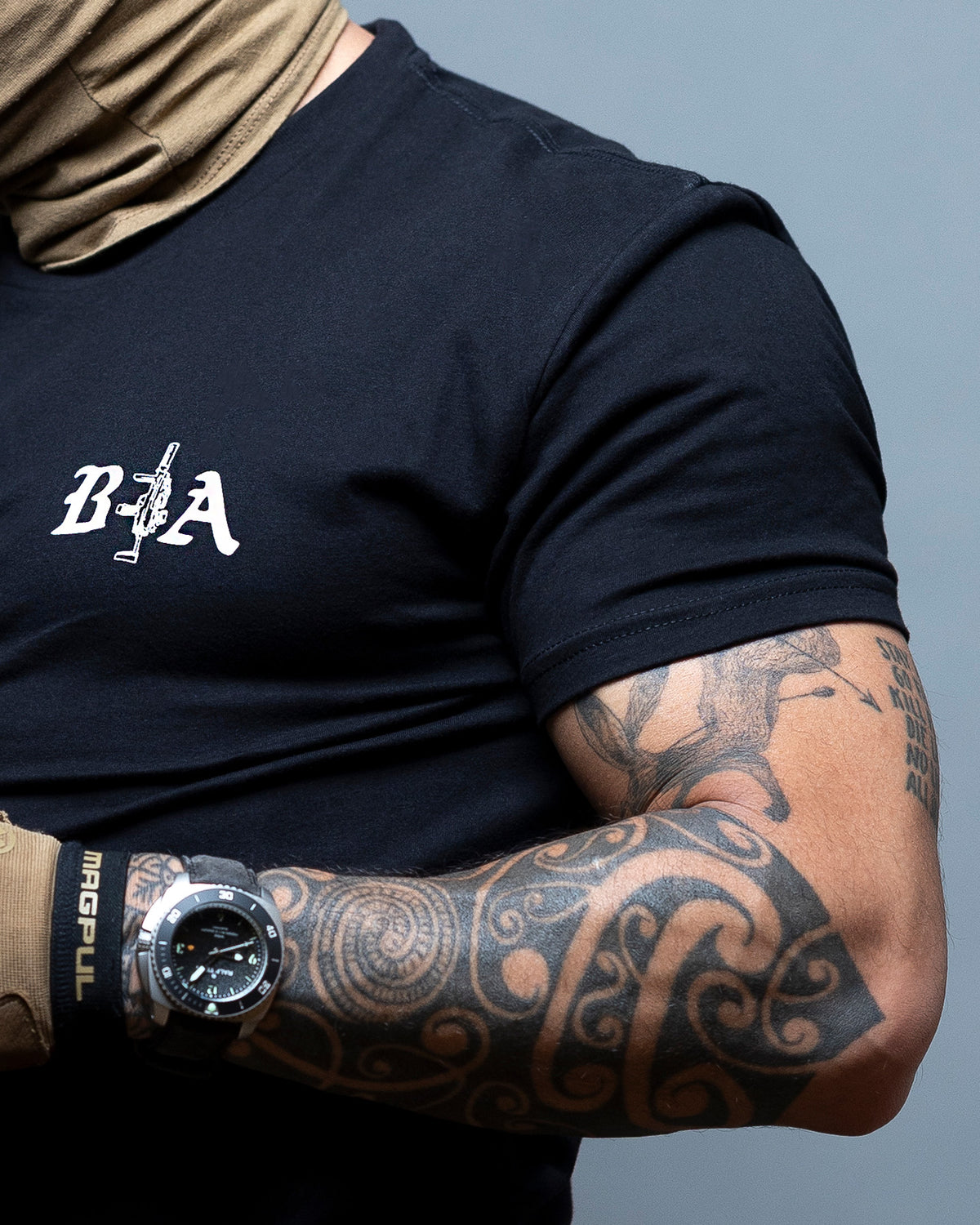 Close-up of the B|A chest logo on the black Hard Times T-Shirt