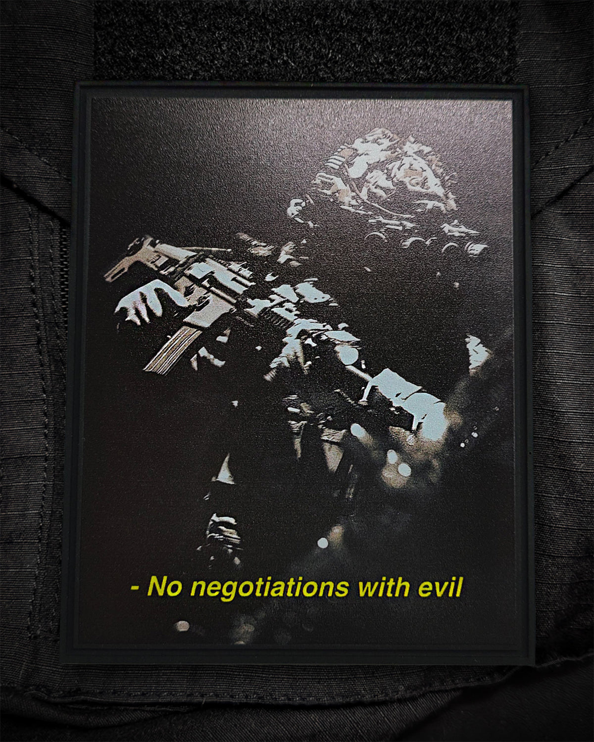 No Negotiations With Evil patch attached to a plate carrier
