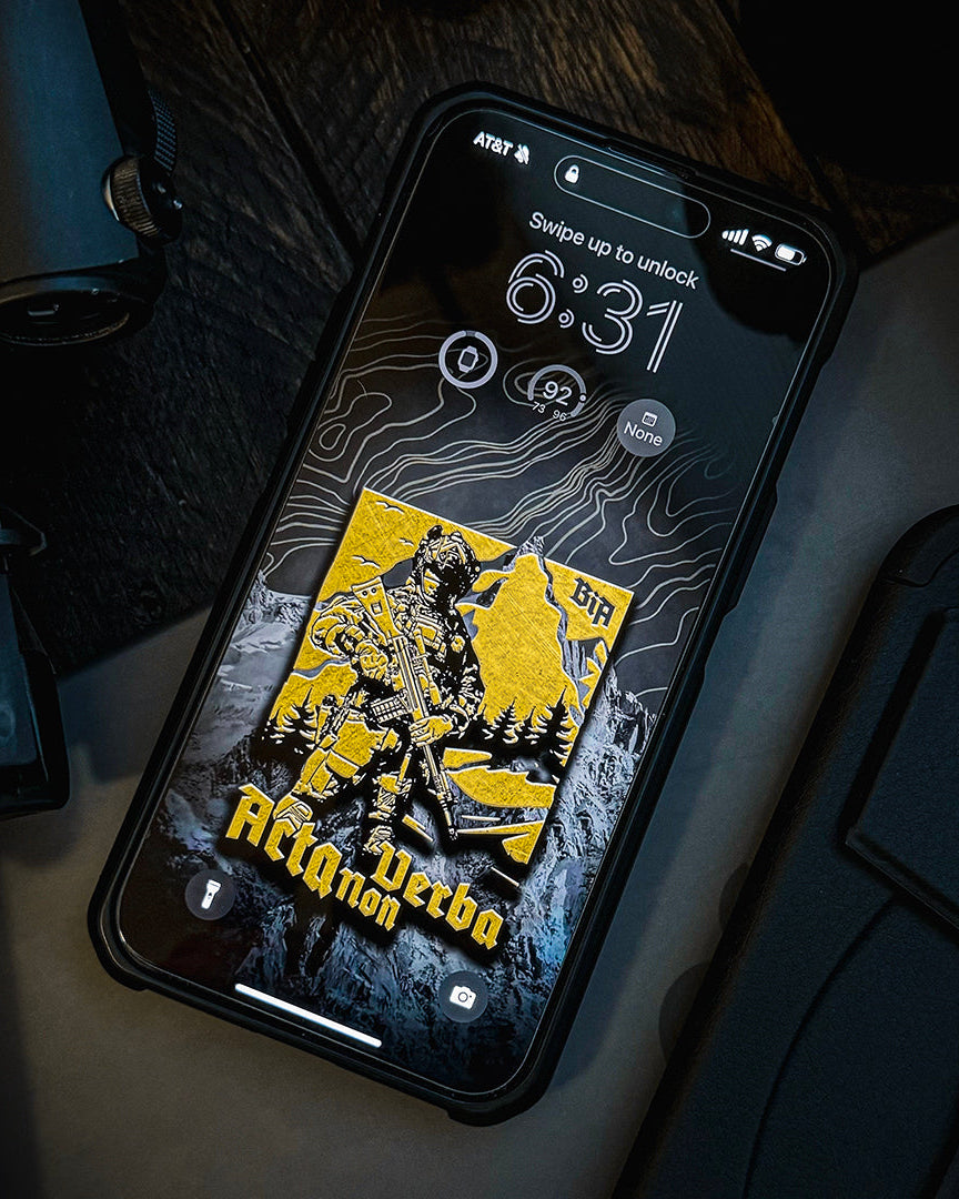 Phone lock screen showing the Acta Non Verba wallpaper with the soldier and mountain artwork