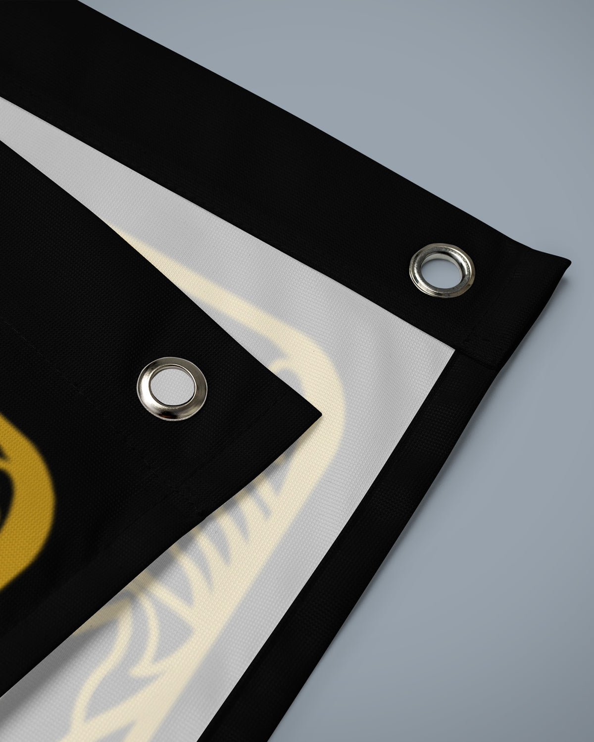 Corner of the Kill Your Demons flag with reinforced edge and metal eyelet