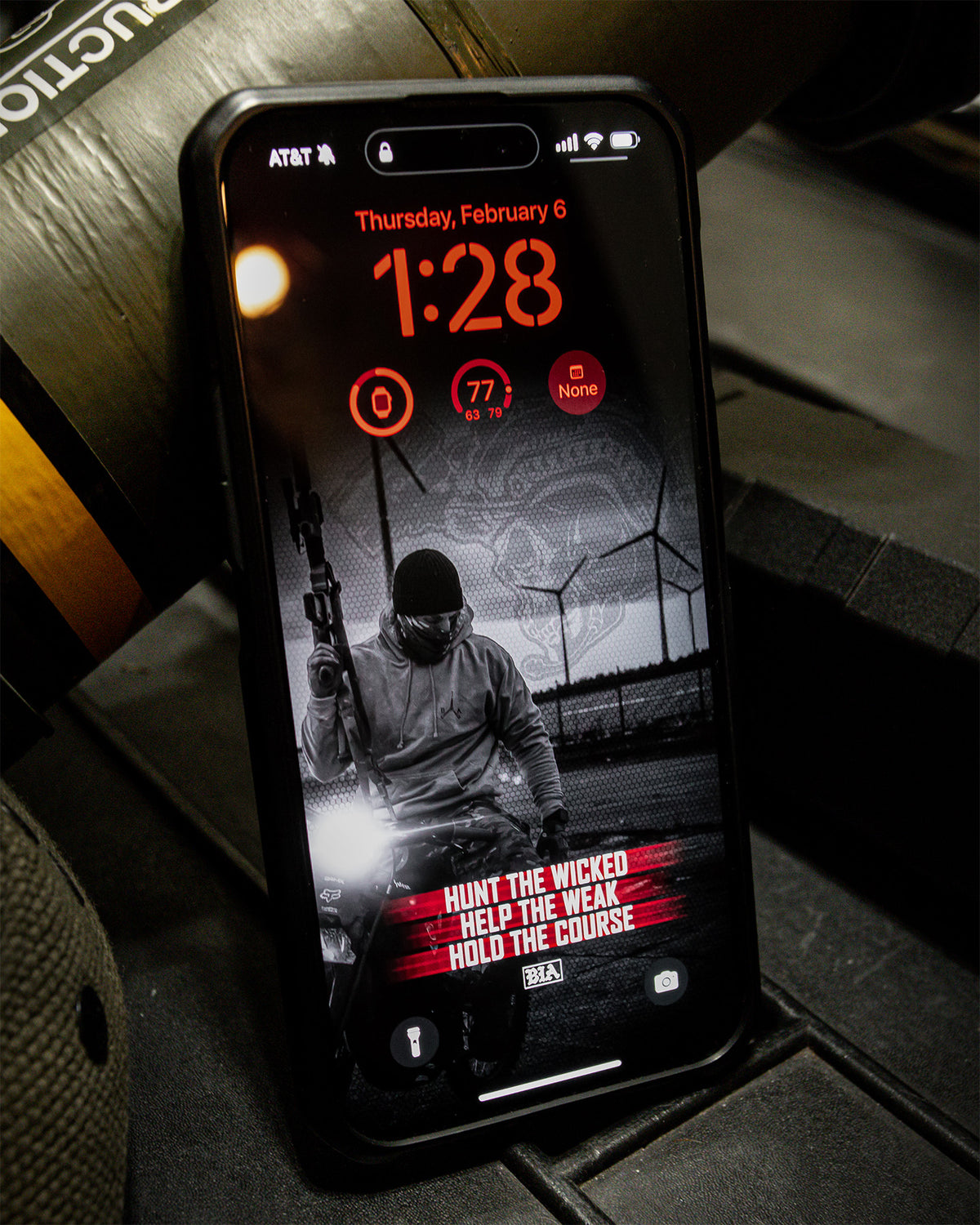 Phone displaying a red wallpaper from the Discipline collection