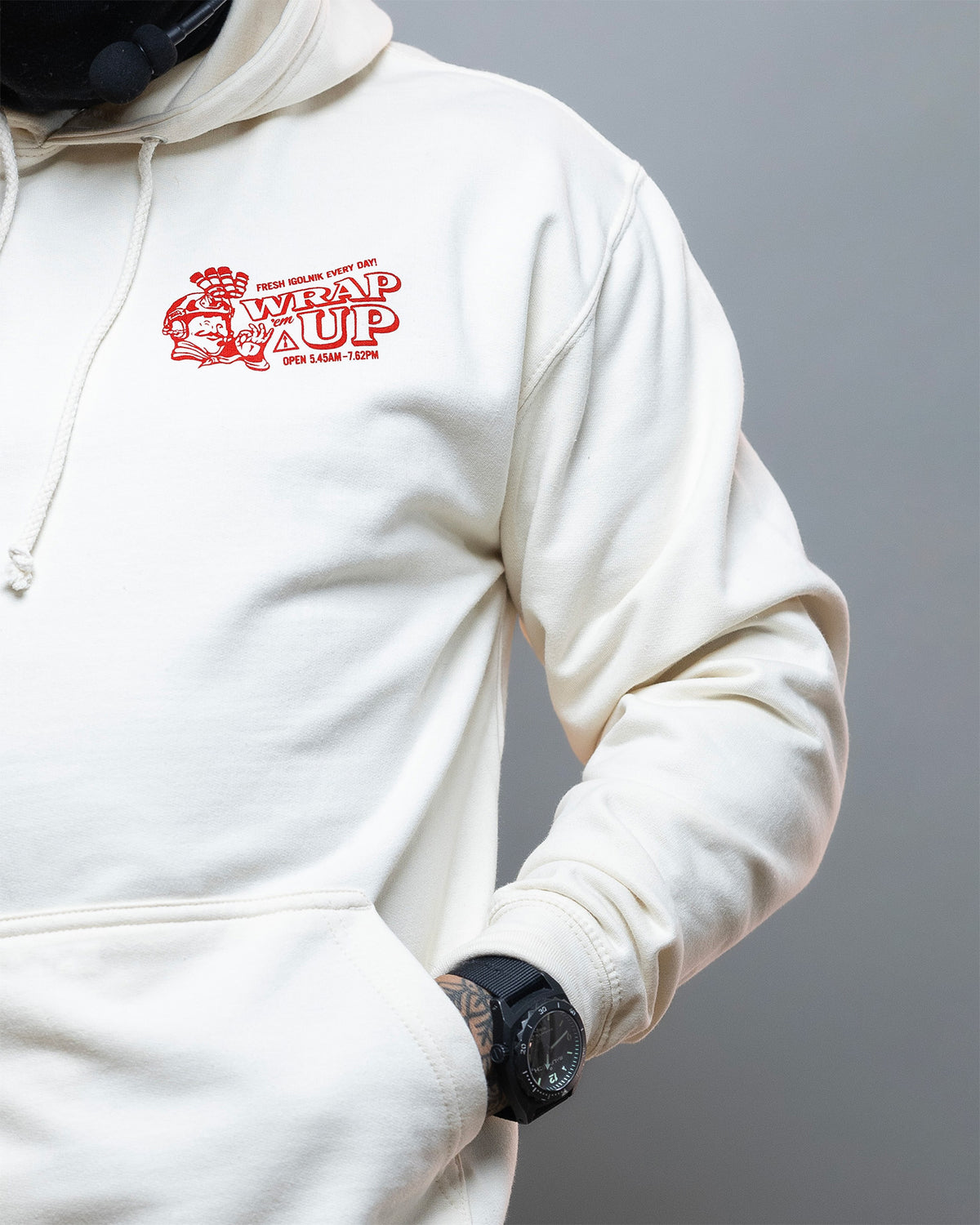 Close-up of the red chest print on the cream Döner Kalash Spicy Hoodie