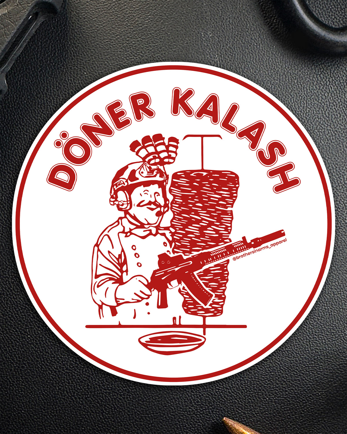 Single round Döner Kalash Spicy sticker in red and white showing a kebab vendor with a rifle