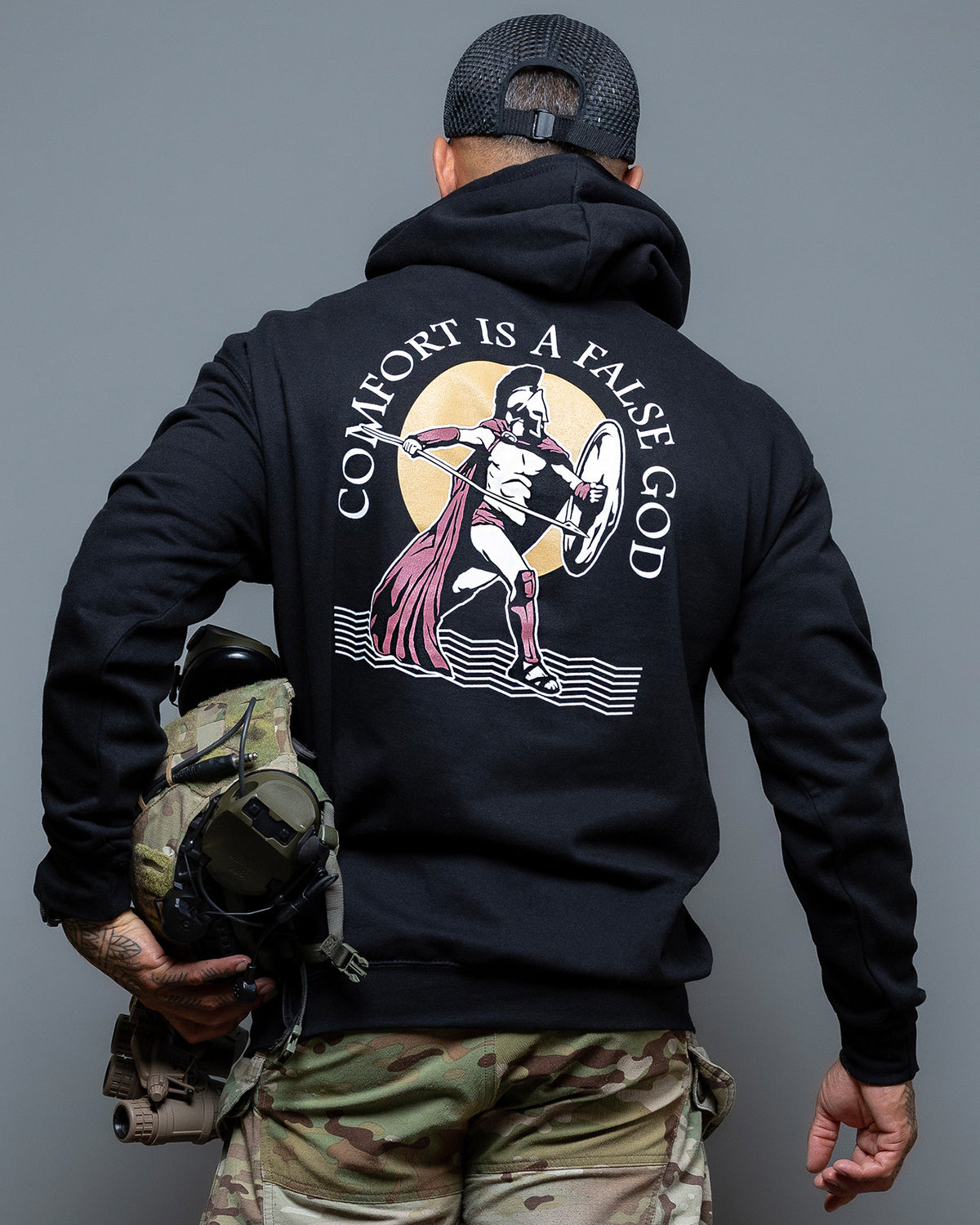 Rear view of the black Comfort Is A False God Hoodie with the Spartan back print