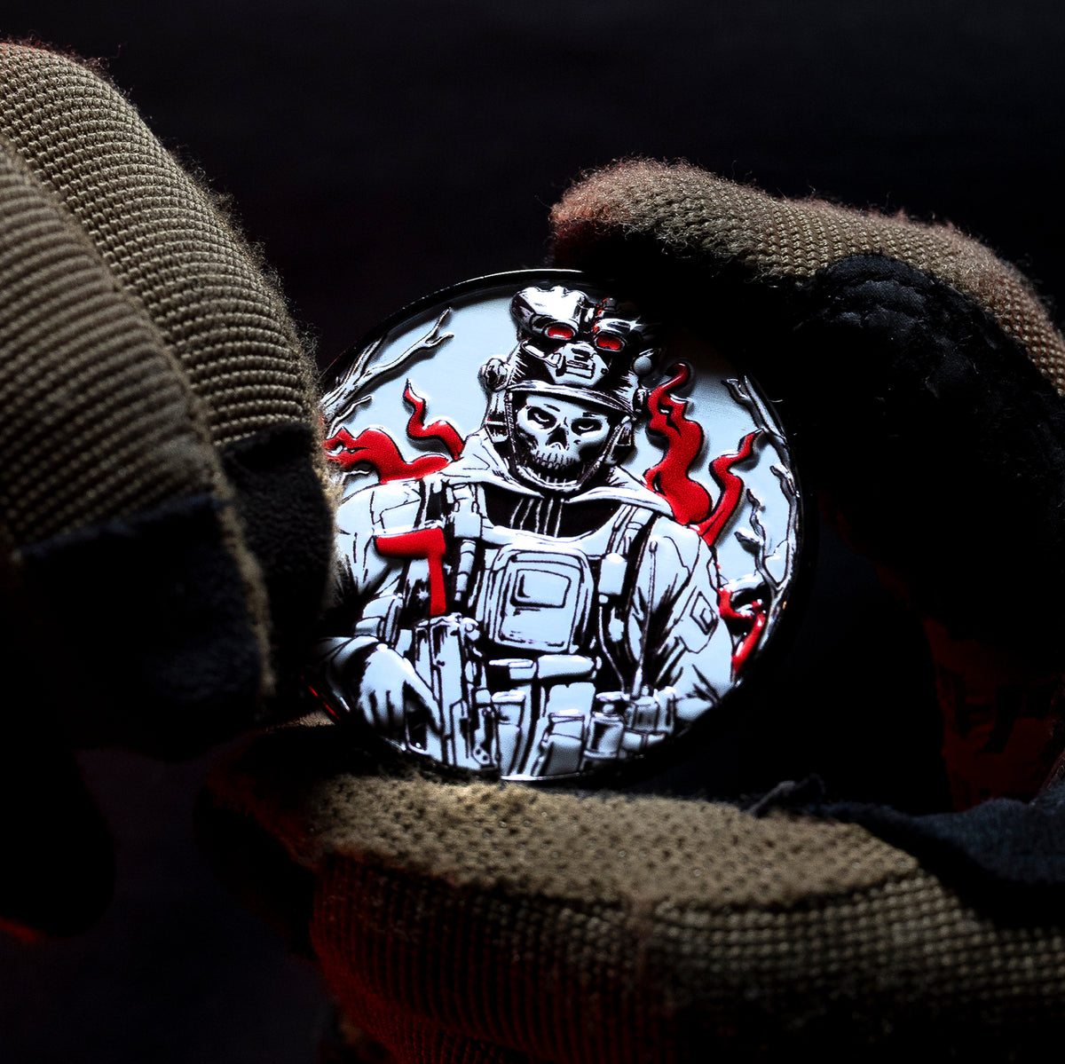 Gloved hand holding the Hard Times coin, skeleton soldier side with red flame accents