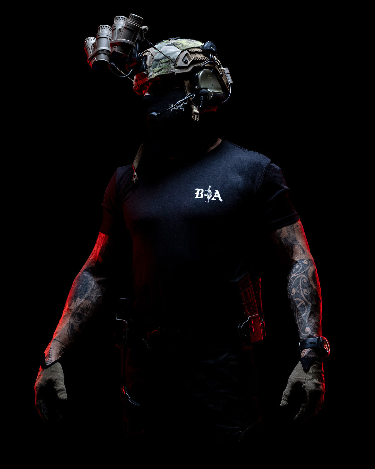 Operator with helmet and face mask wearing the black Hard Times T-Shirt