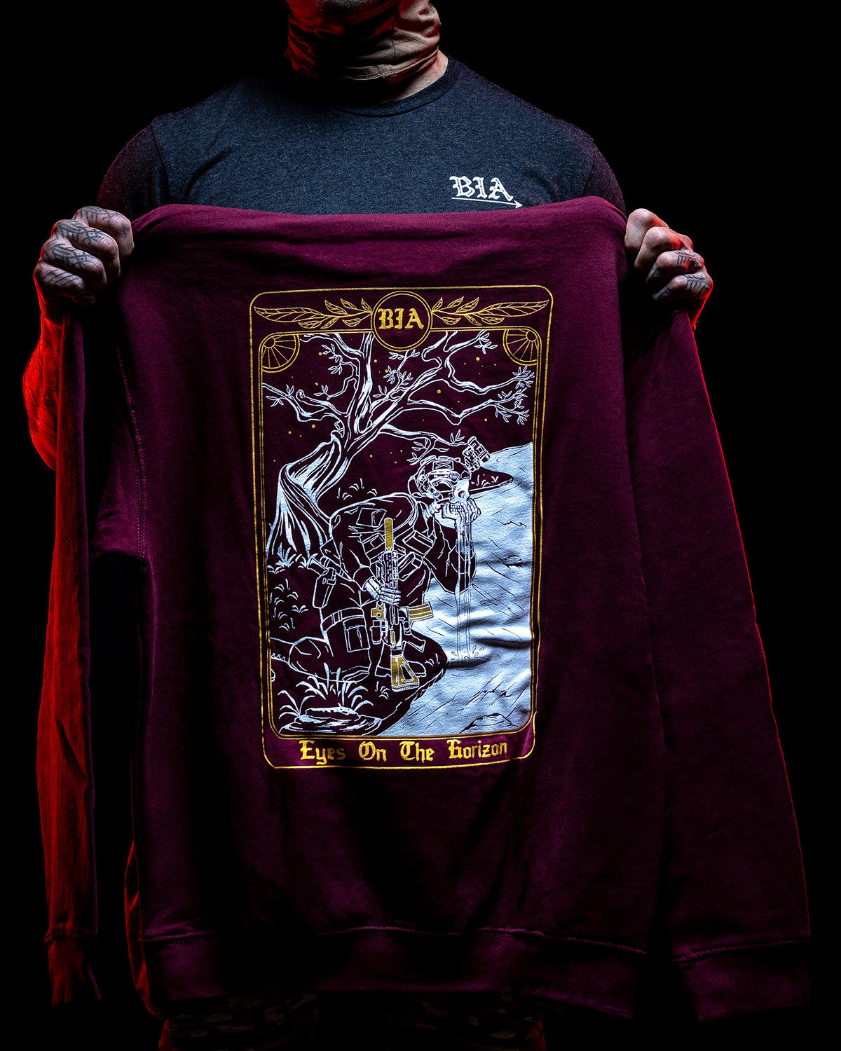 Bordeaux Eyes On The Horizon Hoodie held open to show the tarot card back print