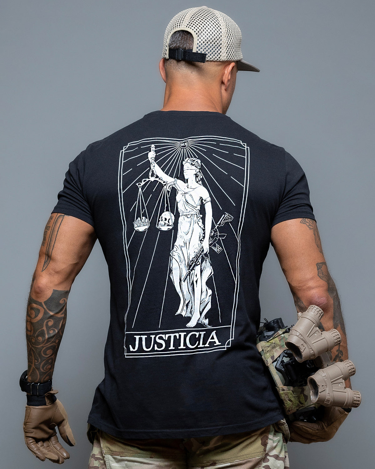 Rear view of the black Justicia T-Shirt with the Lady Justice back print