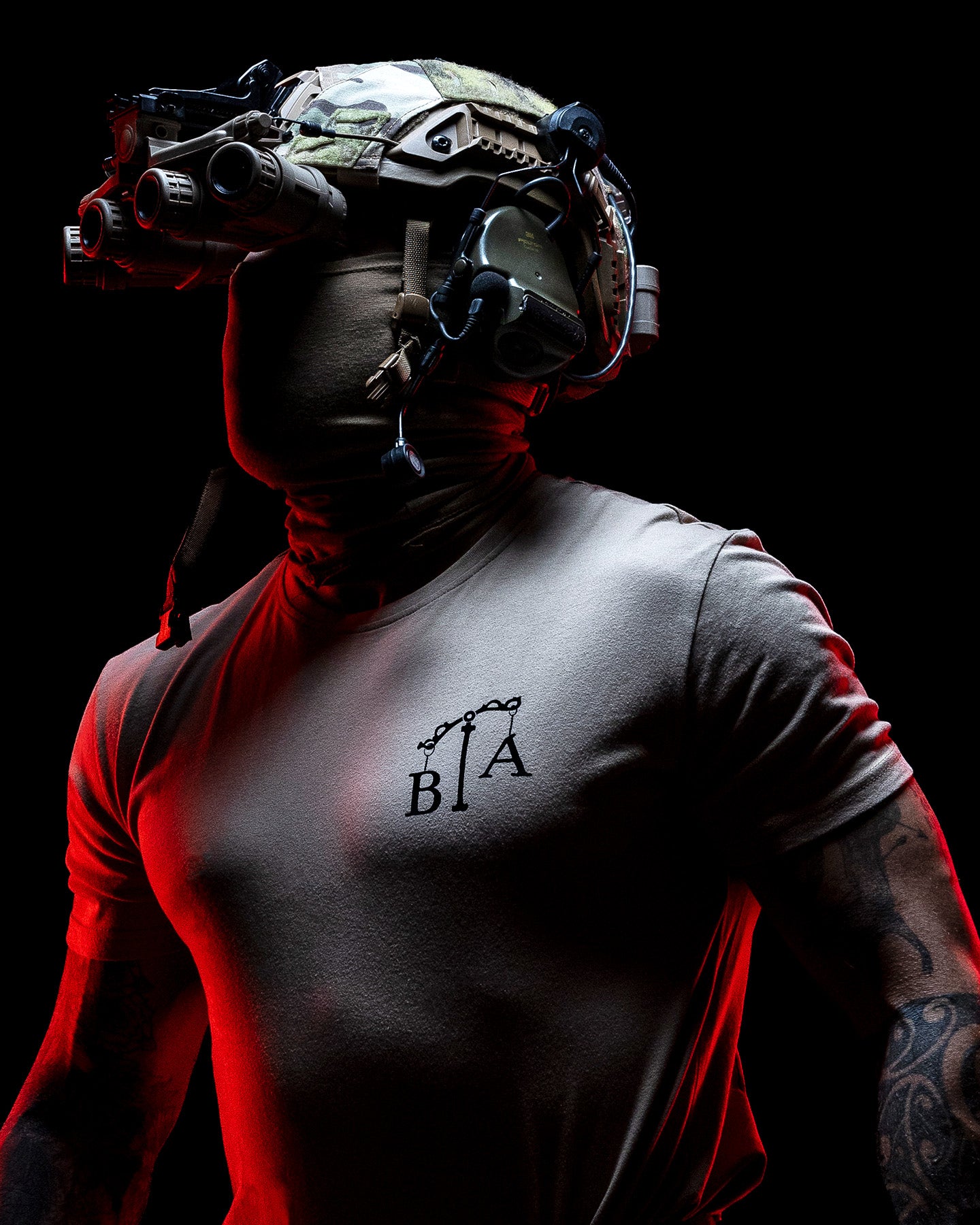 Operator with helmet and night vision in the sand Justicia T-Shirt against a dark background #color_sand #in_field