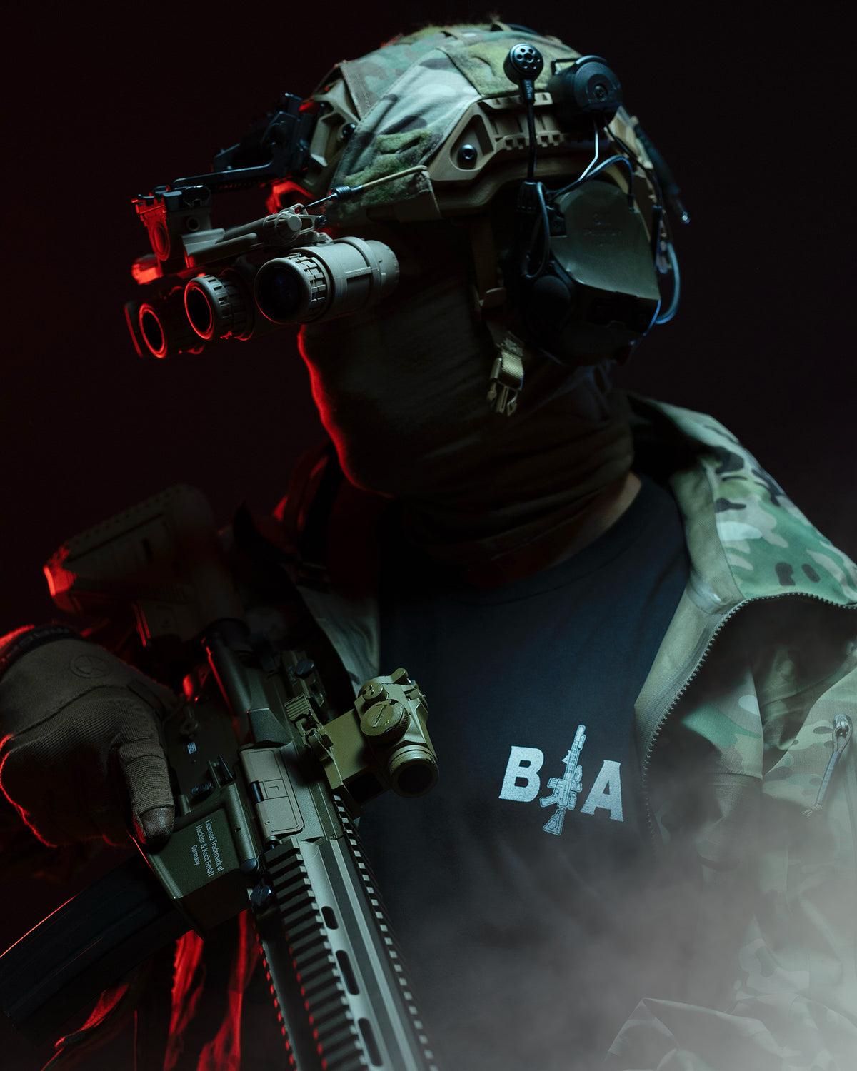 Soldier in full kit with a rifle wearing the black King of Spades T-Shirt