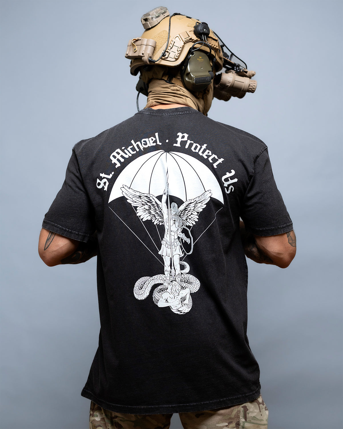 Rear view of the black St. Michael Oversized Shirt with the parachute back print