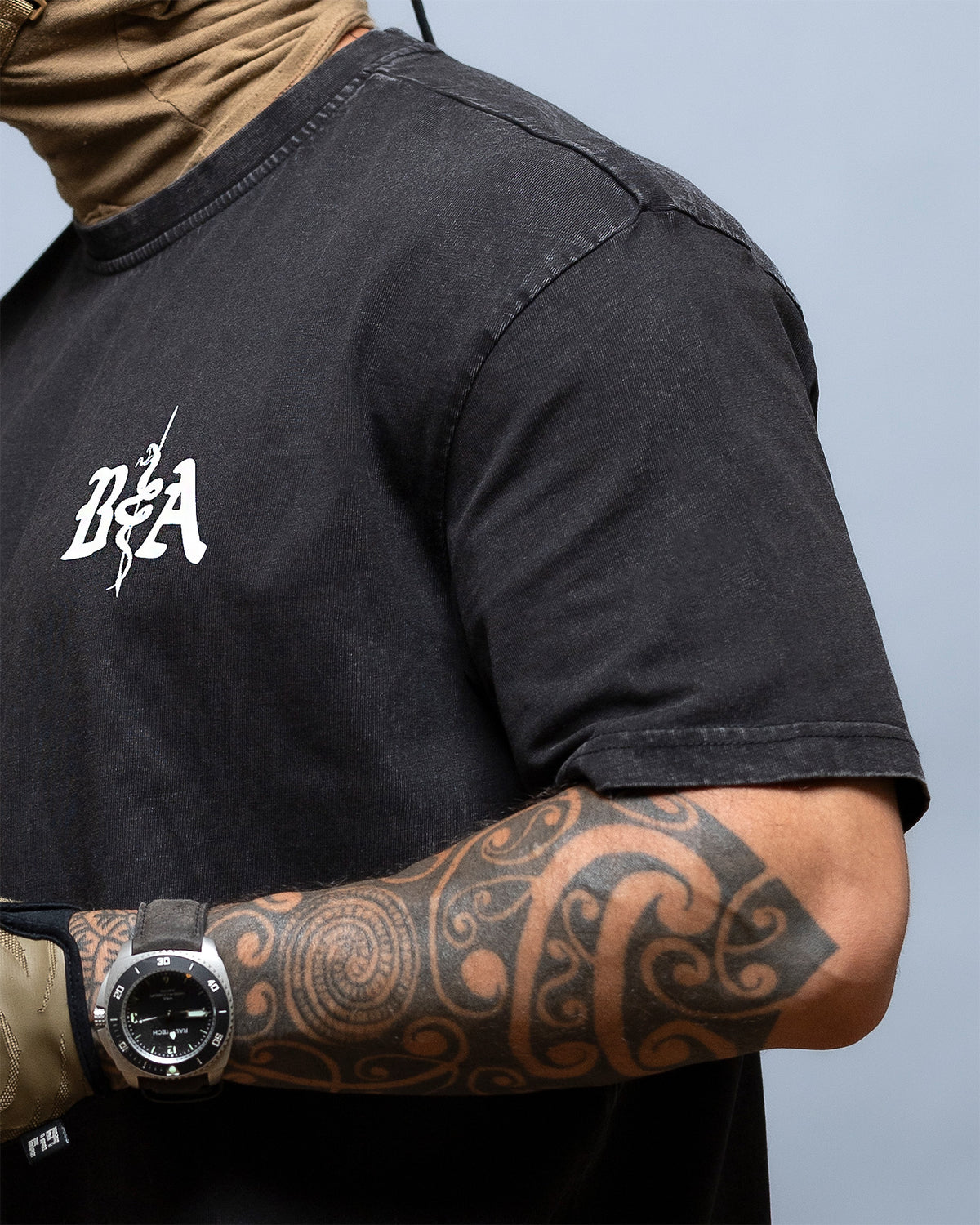 Close-up of the B|A chest logo on the black St. Michael Oversized Shirt