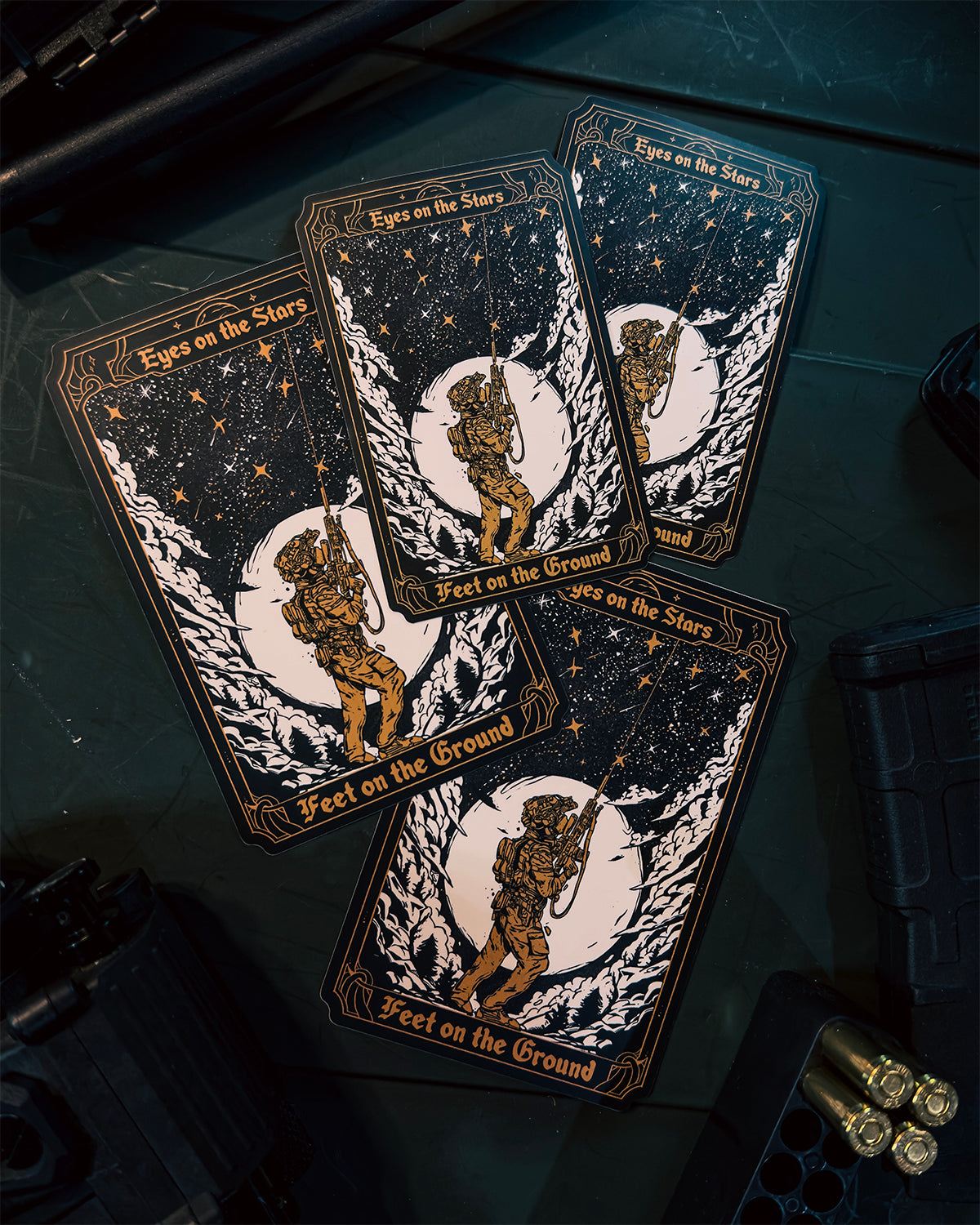 Eyes On The Stars stickers fanned out on a dark surface
