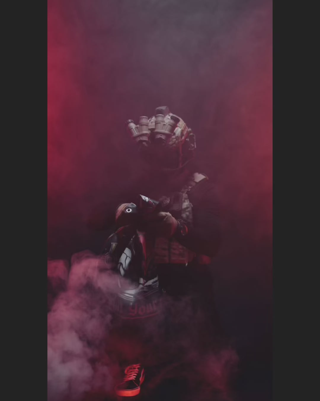 Product video of the Kill Your Demons flag held in red smoke