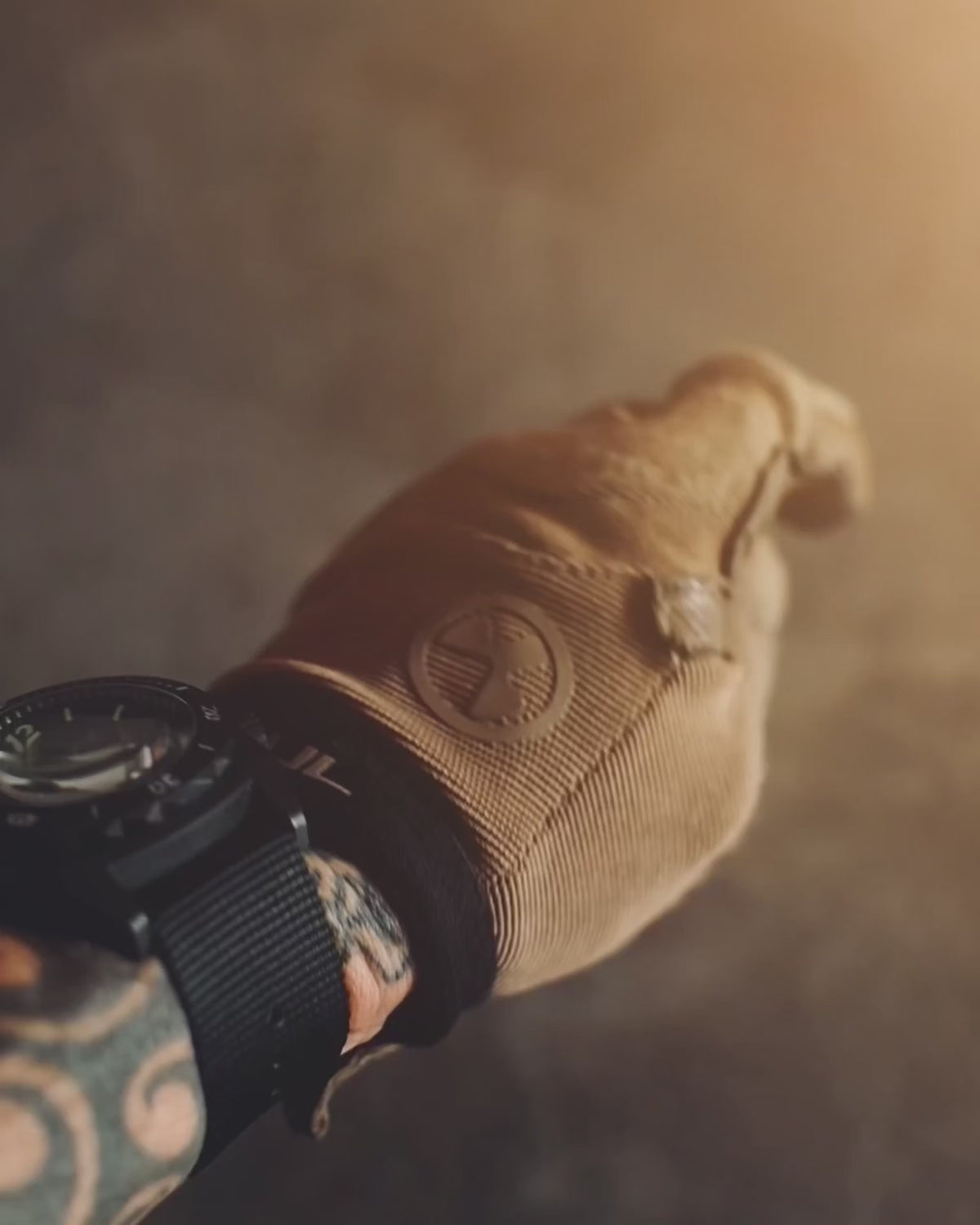 Product video of the Hard Times coin in a gloved hand, shot in studio and in the field